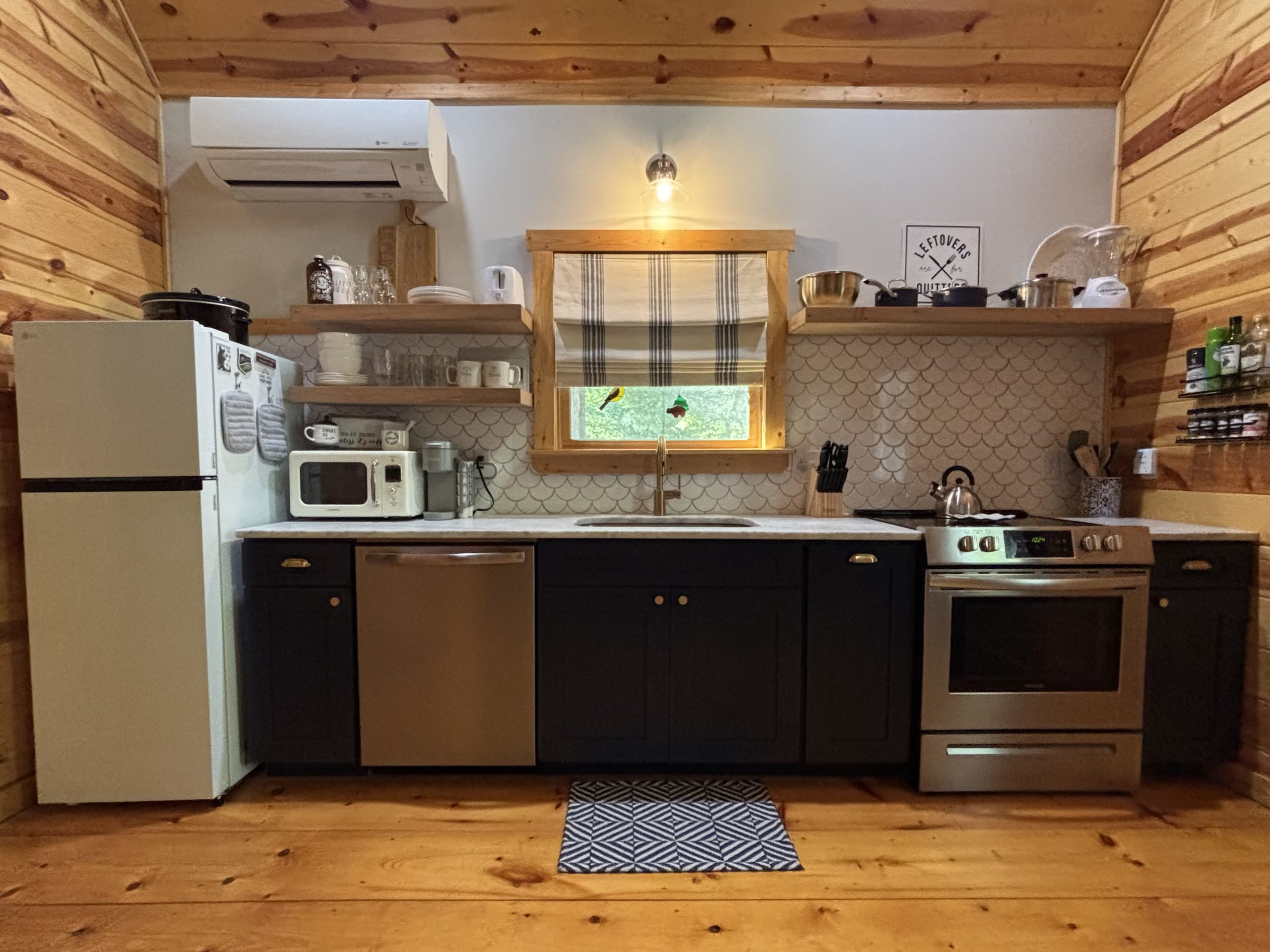 Updated fully equipped kitchen with new refrigerator at The Cozy Nook