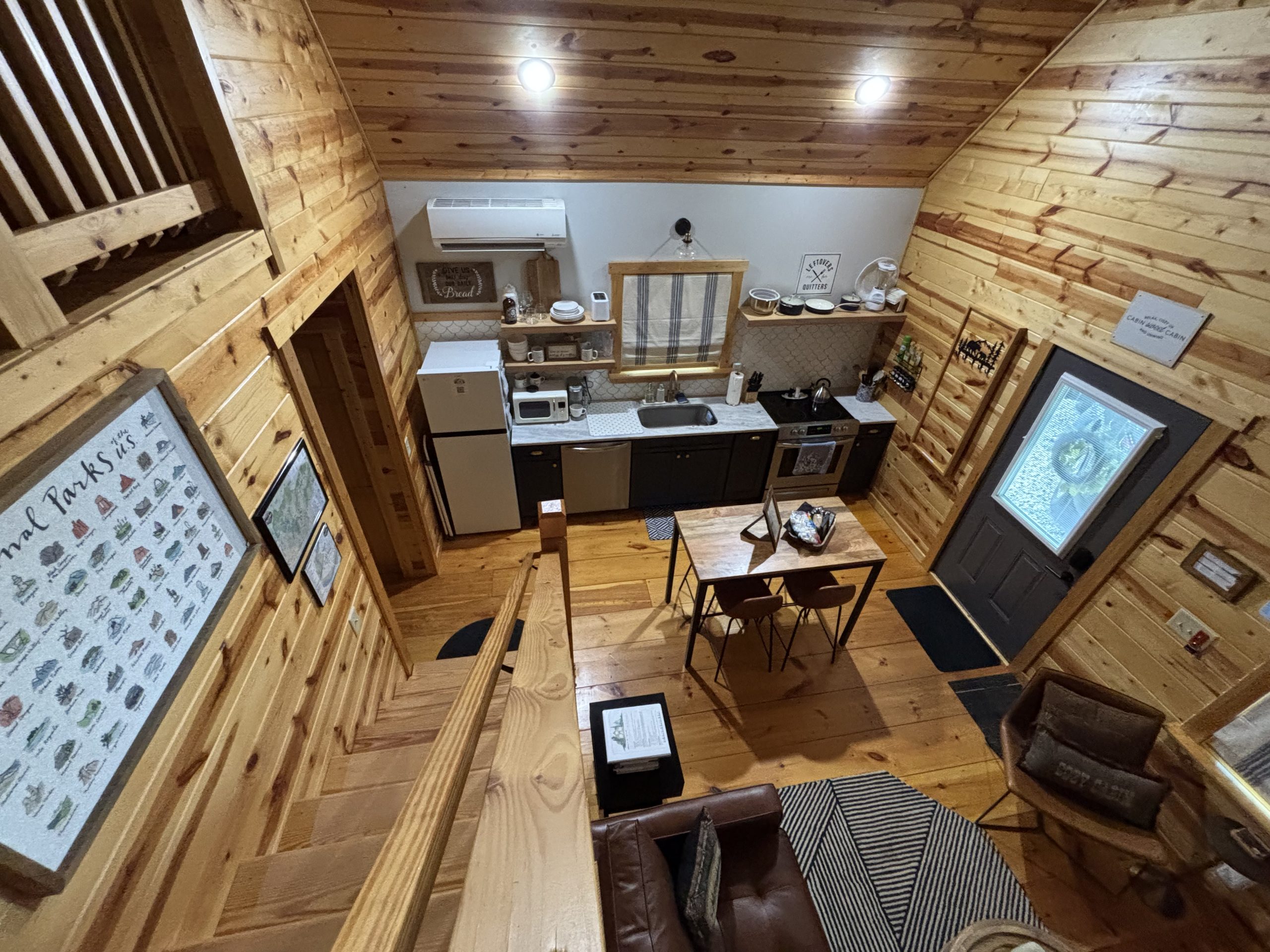 Overhead view of the kitchen and dining area inside The Cozy Nook cabin